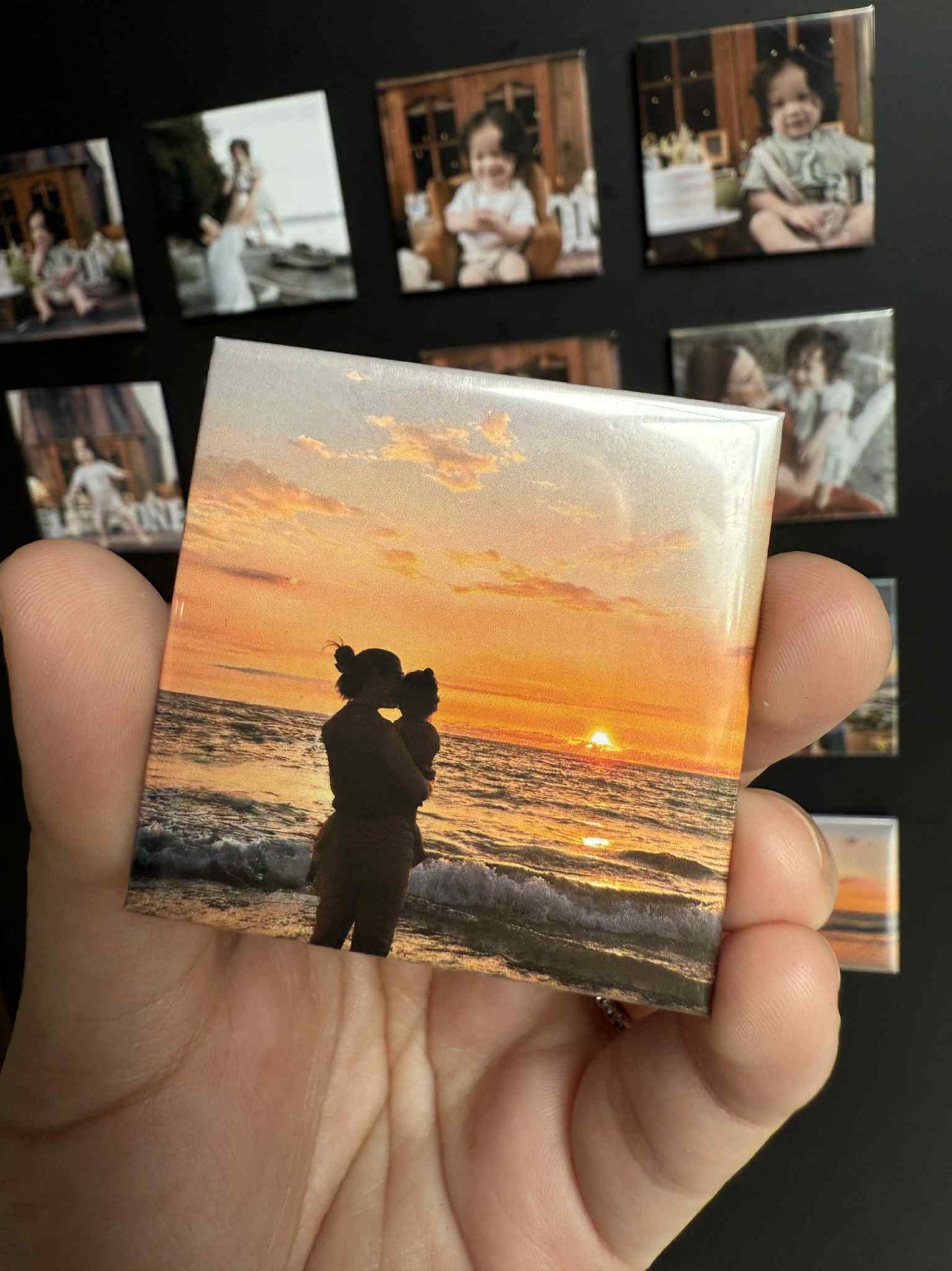 magnet with a picture of mom and baby watching the sunset for the first time
