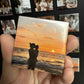 magnet with a picture of mom and baby watching the sunset for the first time